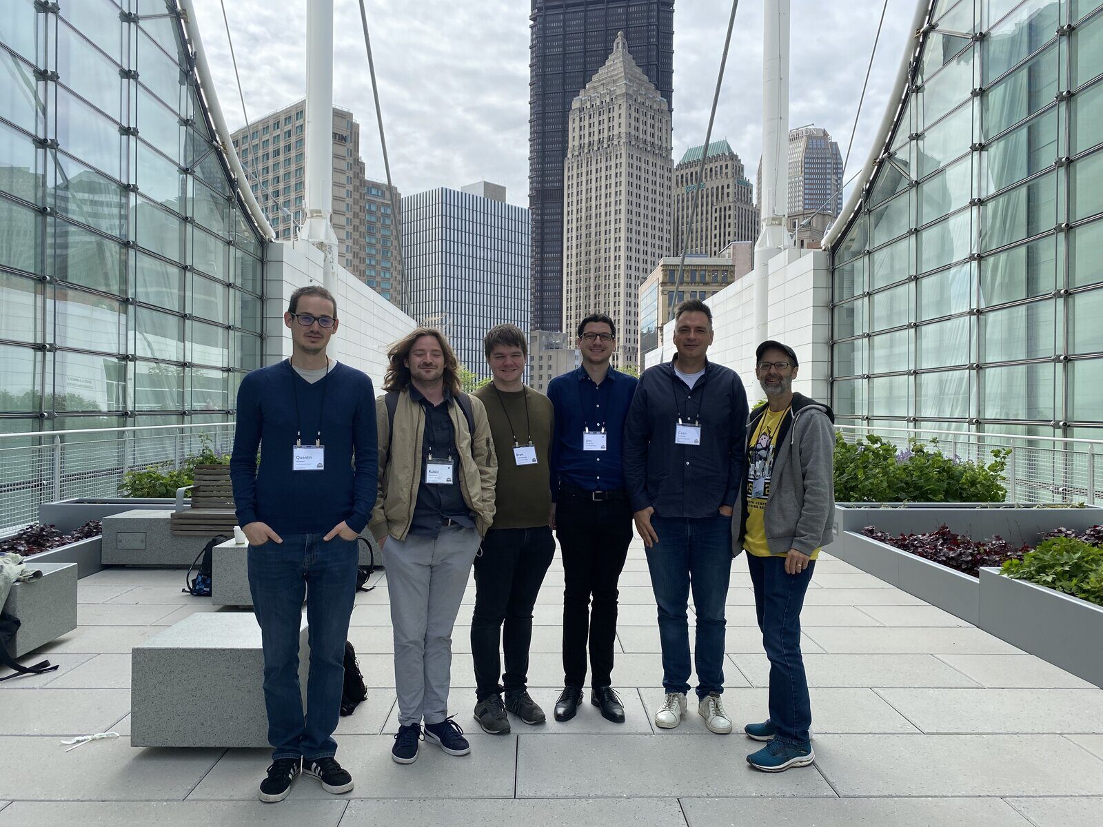SOFT researchers in front of a city skyline during a conference trip